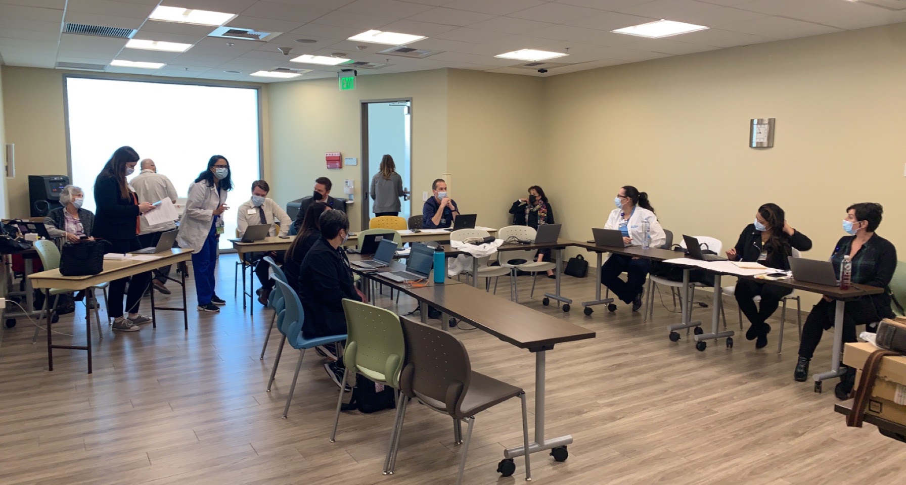 Executive healthcare leaders collaborating around a conference table on strategic advisory execution